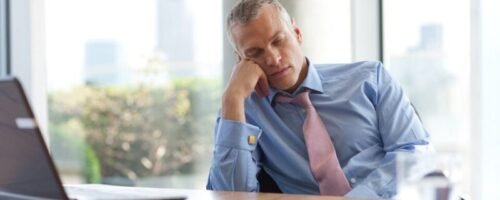 man struggling with excessive daytime sleepiness caused by hypersomnia